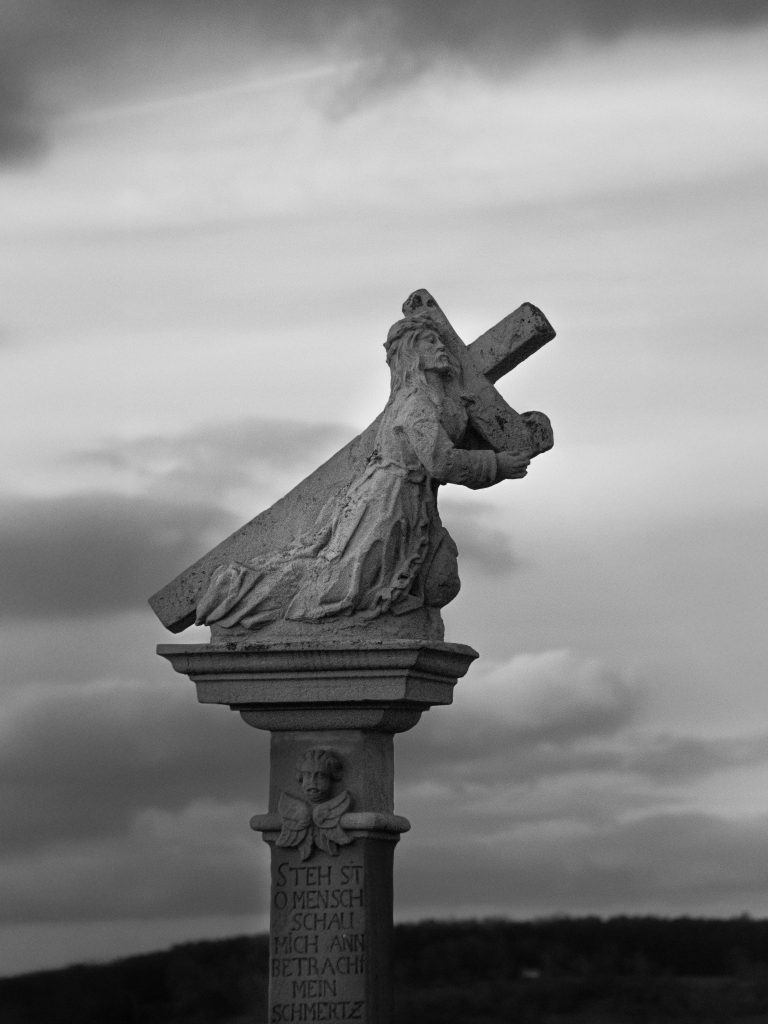 Striking photo of Jesus carrying the cross demonstrating God's sacrifice and God's Forgiveness